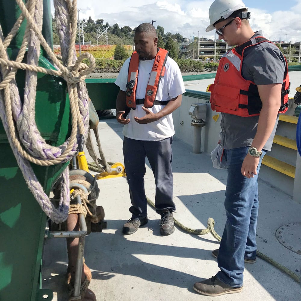 Cortland engineers assessing rope on tugboat